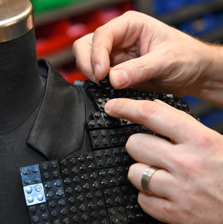 Illustration for article titled It Took Over 10,000 Bricks to Make This Wearable Lego Batman Jacket